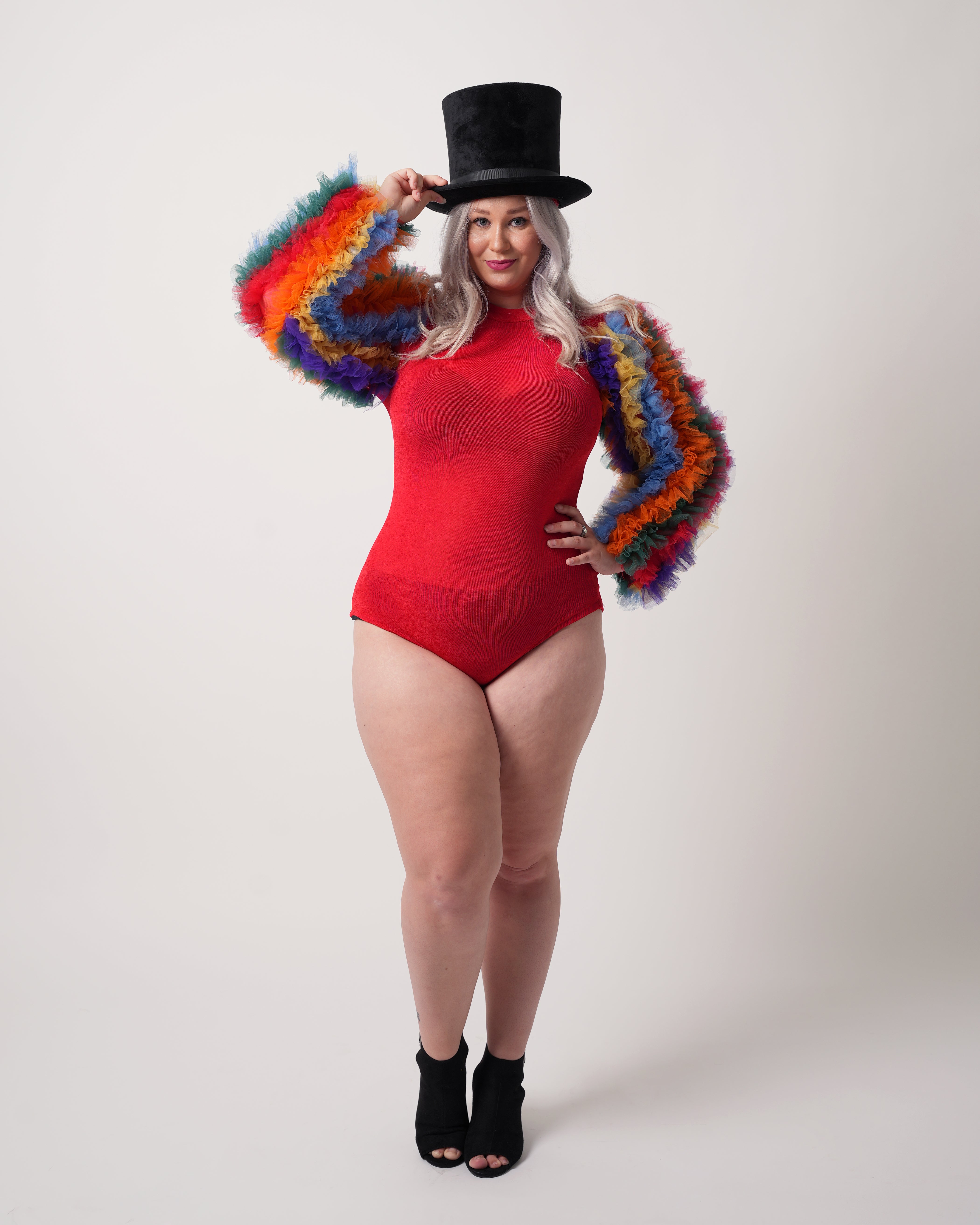 Sugar Spectrum Bodysuit in red with rainbow ruffle sleeves, front view